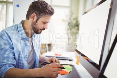 Young businessman working in creative office