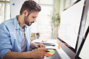 Young businessman working in creative office