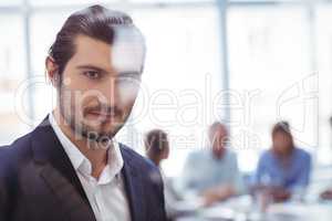 Businessman at office seen through glass