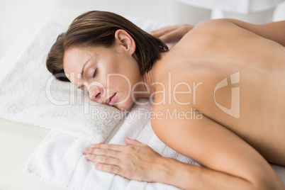 Naked woman relaxing in spa