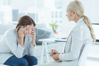 Sad woman with therapist