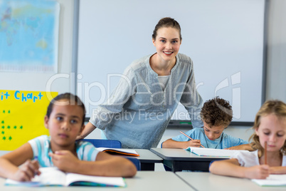 Smiling female teacher with children