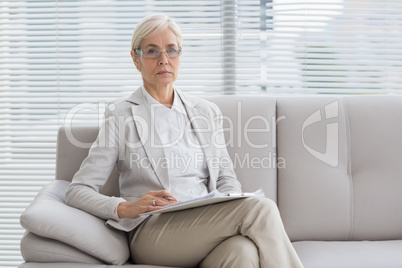 Portrait of therapist sitting on sofa