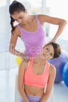 Woman exercising with trainer