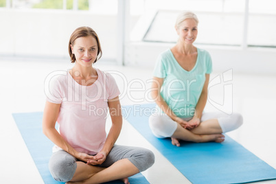 Portrait of smiling women doing yoga