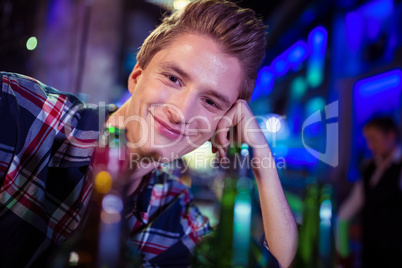Portrait of smiling man at bar counter