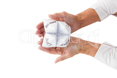 Person holding origami fortune teller