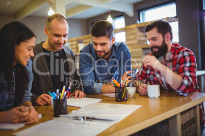 Creative business people discussing at table