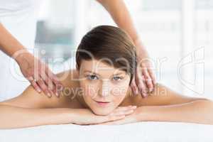 Portrait of relaxed woman receiving massage