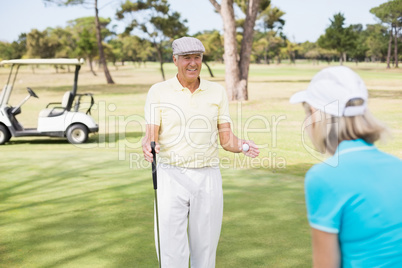 Mature golfer couple