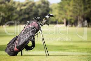 Filled golf bag with golf club