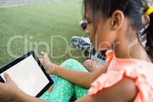 High angle view of using digital tablet
