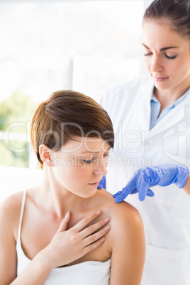 Doctor examining beautiful woman