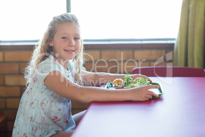 Cute girl having meal
