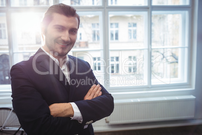 Smiling businessman in creative office
