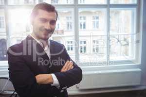 Smiling businessman in creative office