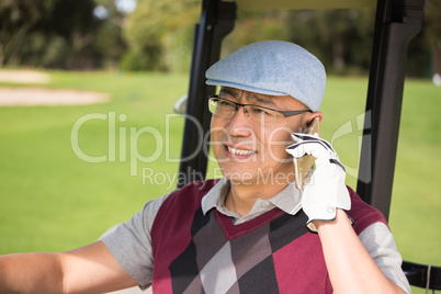 Golfer smiling and calling