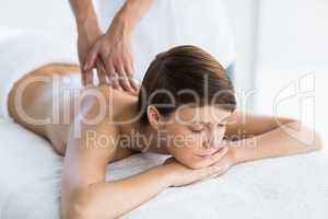 Beautiful woman enjoying back massage