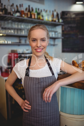 Portrait of confident female worker at coffee house