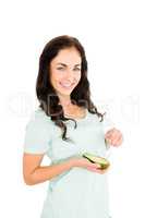 Portrait of smiling woman holding avocado