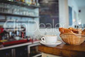 Close-up of fresh coffee and breads at cafe