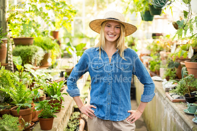 confident female gardener at greenhouse