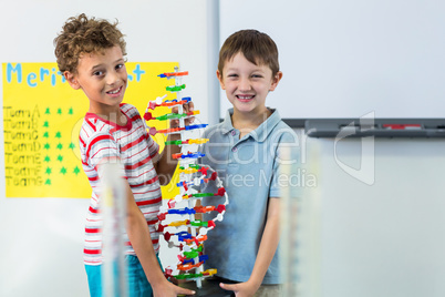 Boys holding DNA model