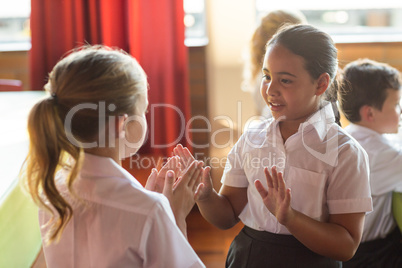 Cute girls playing clapping game