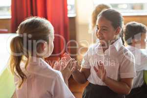 Cute girls playing clapping game