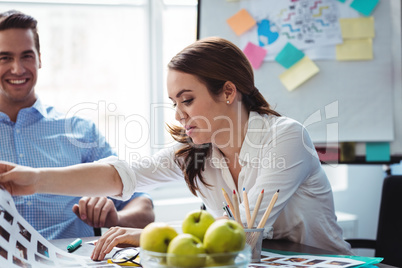 Photo editor with smiling male colleague