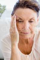 Close-up of woman suffering from headache