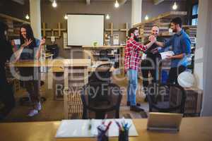 Business people during coffee break in office