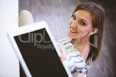 Portrait of happy executive giving digital tablet at office Portrait of happy executive giving digital tablet at office
