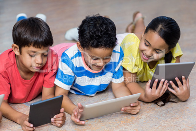 Cute children using digital tablets