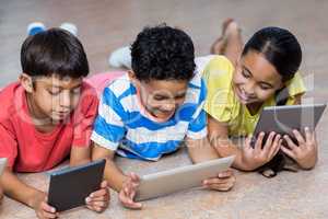 Cute children using digital tablets