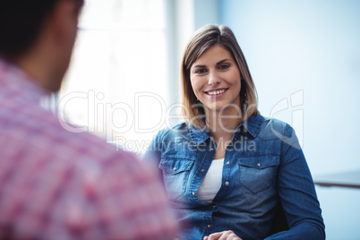 Happy businesswoman with coworker