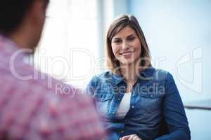 Happy businesswoman with coworker