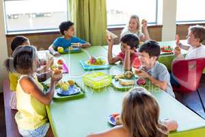 Schoolchildren having meal