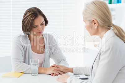 Therapist comforting her patient