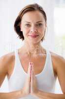 Portrait of smiling woman doing yoga