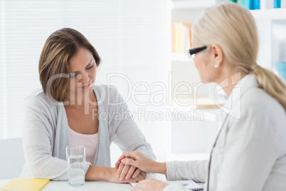 Therapist comforting woman