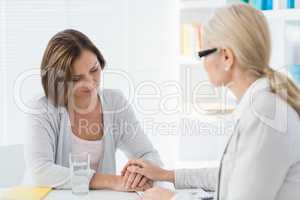 Therapist comforting woman