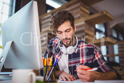 Businessman working at computer desk in office