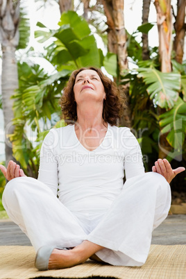 Mature woman practicing yoga