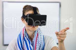Teacher using virtual reality headset in classroom