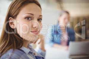 Portrait of young businesswoman at creative office