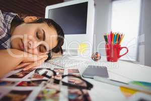 Young woman sleeping in office