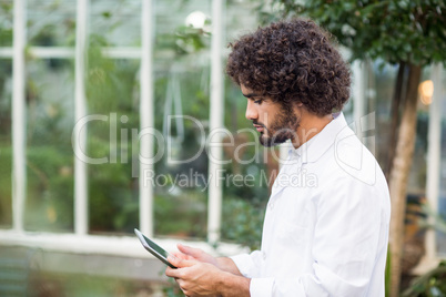 Male scientist using digital tablet