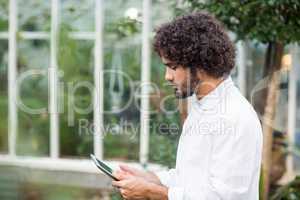 Male scientist using digital tablet