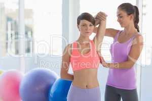 Trainer working with young woman